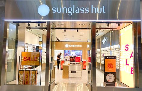 who owns sunglasses hut